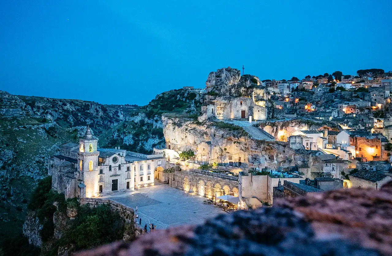 The illuminated Sassi stone dwellings of Matera, Italy, at dusk