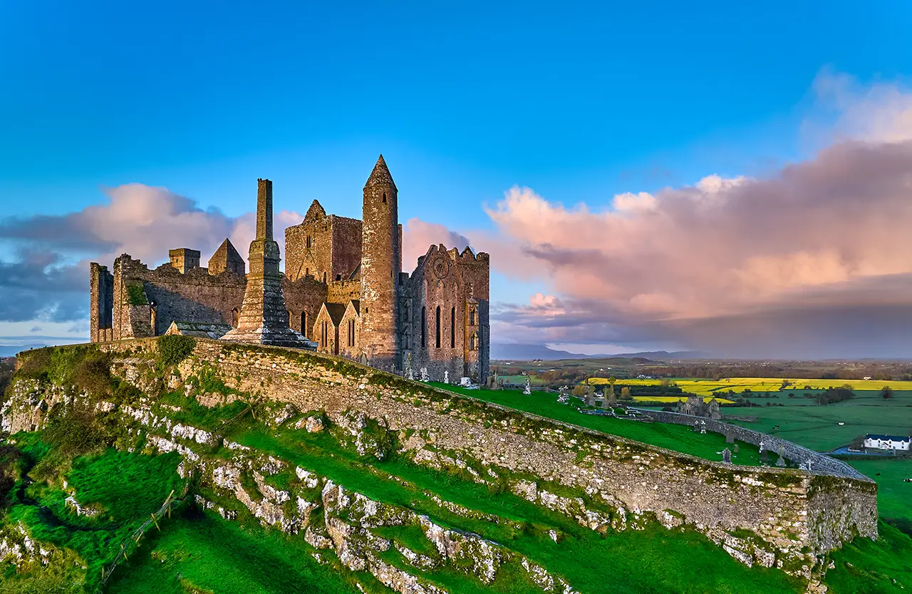 The Rock of Cashel medieval castle on a green hilltop in Ireland